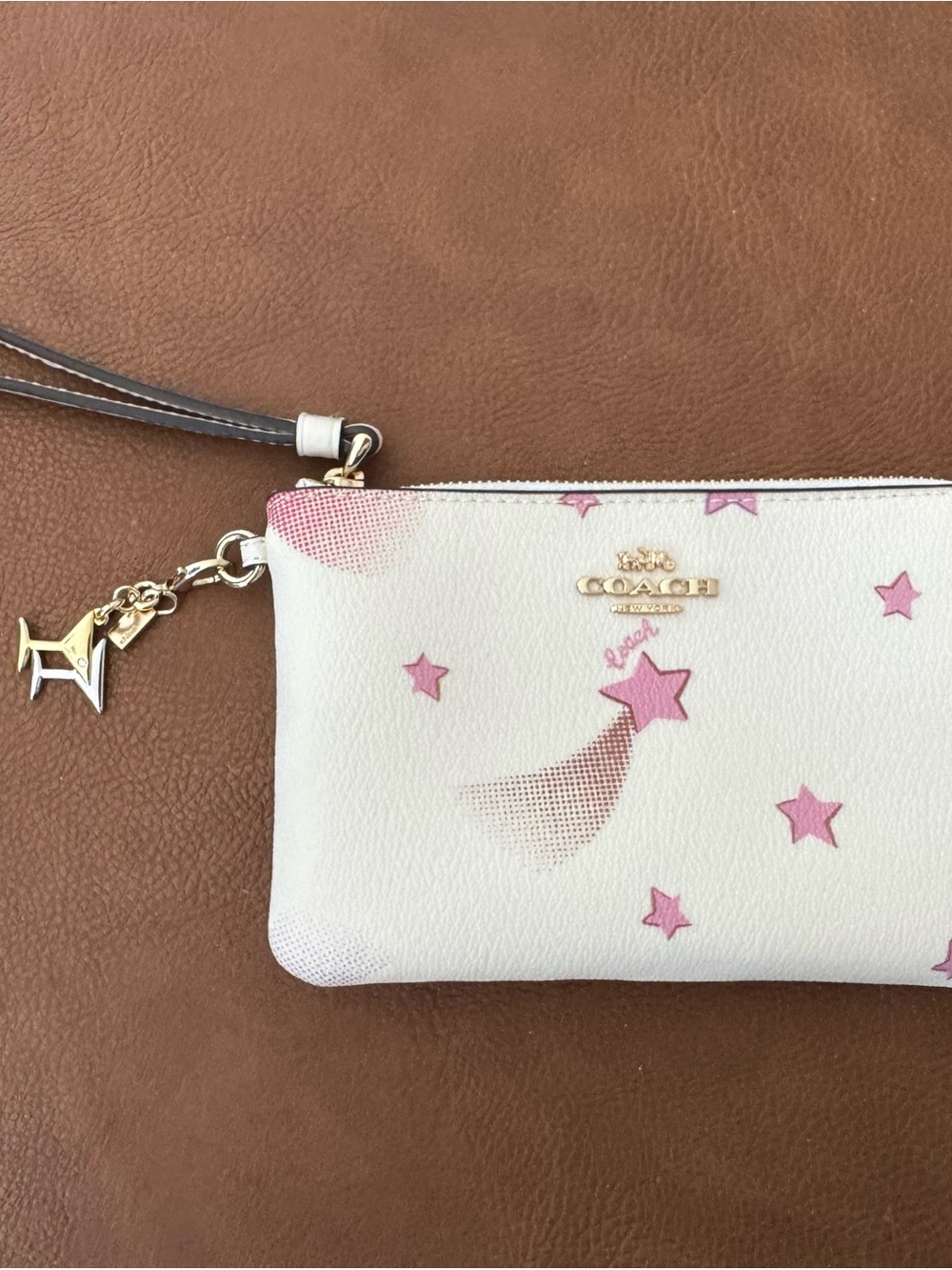 Coach White Wristlet with Pink Star Motif and Gold Charm